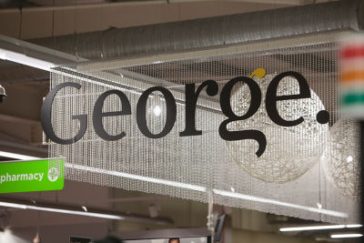 A department sign hangs from the ceiling and reads "George."