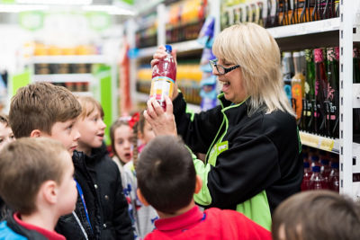 Ruby Edmunds from Aberdare Town Church Primary School and plastic investigators at Asda Aberdare