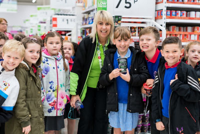 Ruby Edmunds from Aberdare Town Church Primary School and plastic investigators at Asda Aberdare