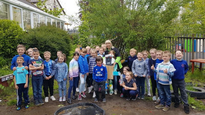 Ruby Edmunds from Aberdare Town Church Primary School and plastic investigators at Asda Aberdare