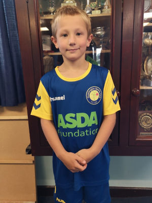 Oscar from Ducklington Football Club in his new kit bought with a grant from the Asda Foundation