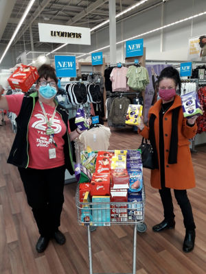 Dundee bairns receiving a donation of Easter eggs for local children.  | Asda Dundee West