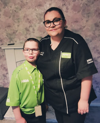 Oliver Neilson dresses in Asda uniform for school superhero day