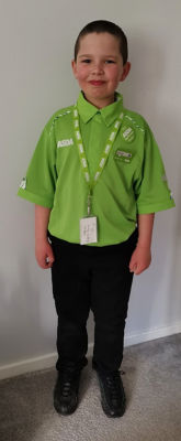 Oliver Neilson dresses in Asda uniform for school superhero day
