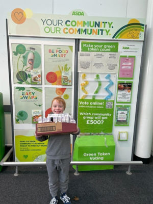 Harry from Heathryburn School PTA was happy to accept our donation of boxes of raisins they are using as part of a fundraiser. | Asda Dyce