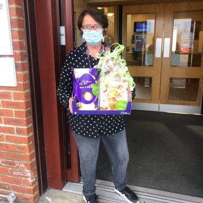 Janice from our local hospice receiving a donation of Easter eggs to help with some much needed fundraising. | Asda Hartlepool
