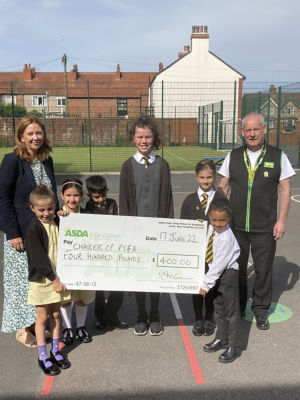 Chaucer Community Primary School PTFA receiving the DGTG cheque for £400 | Asda Fleetwood