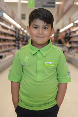 Four-year-old Huzaifah Ahmed in his Asda uniform