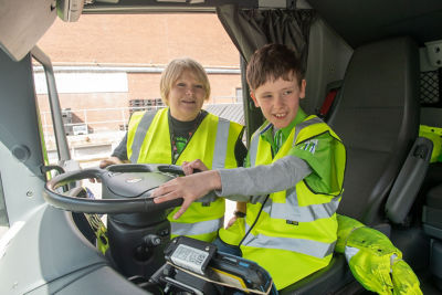 Aaron in a lorry at Asda Falkirk with community champion Margaret Bradie