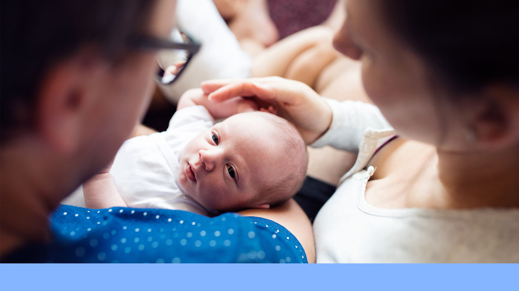 Parents holding a baby