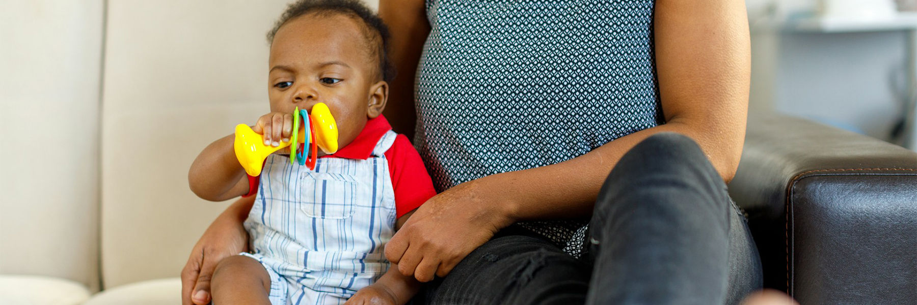 Baby playing with a rattle