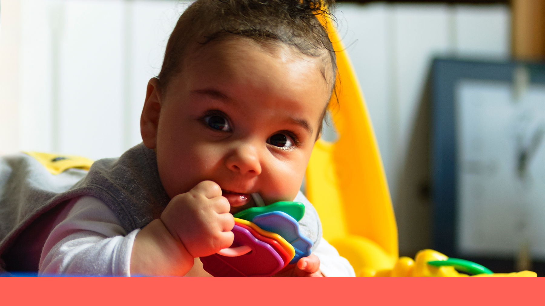 Baby playing with a rattle