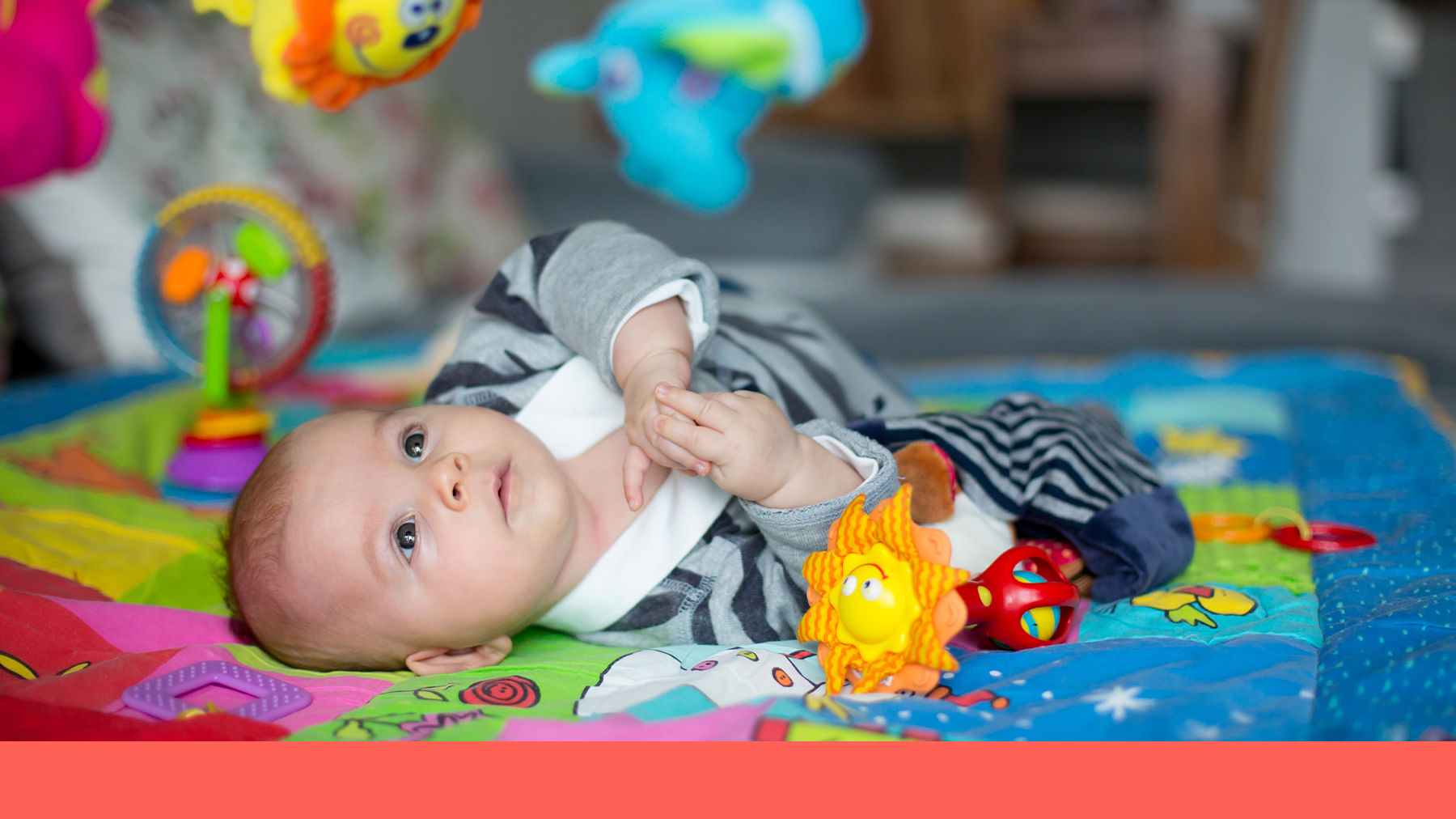 Baby playing on a mat
