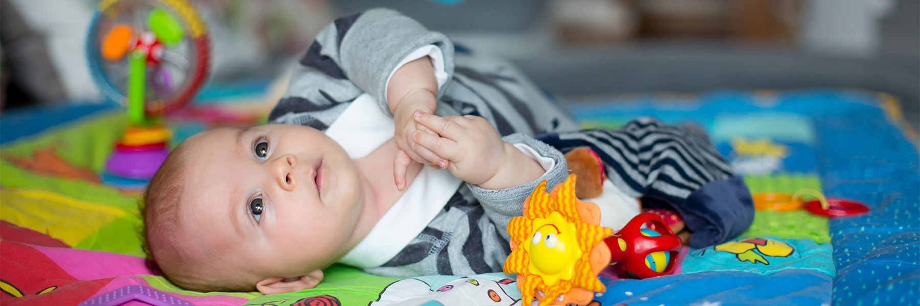 Baby playing on a play mat