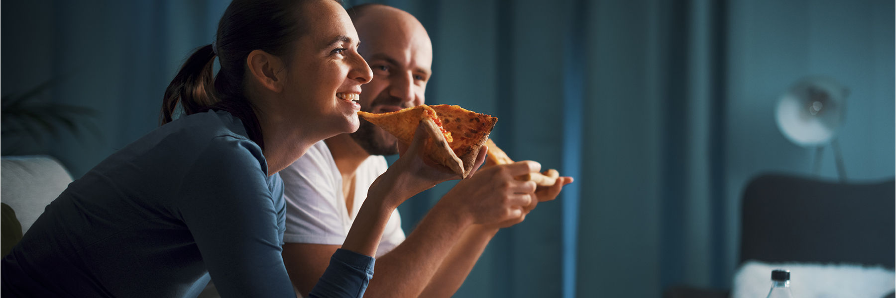 Couple eating pizza