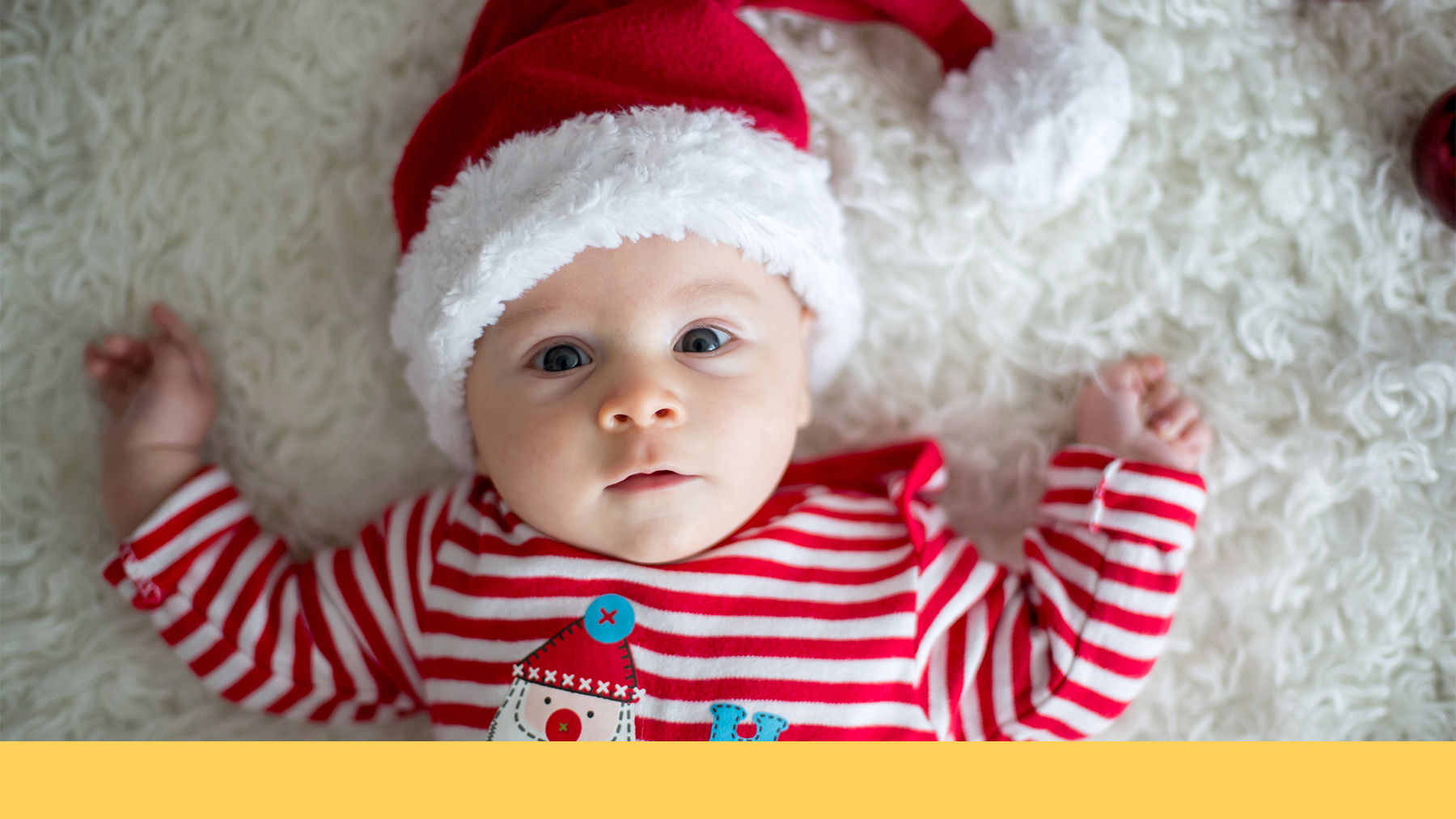 Baby wearing a Santa hat