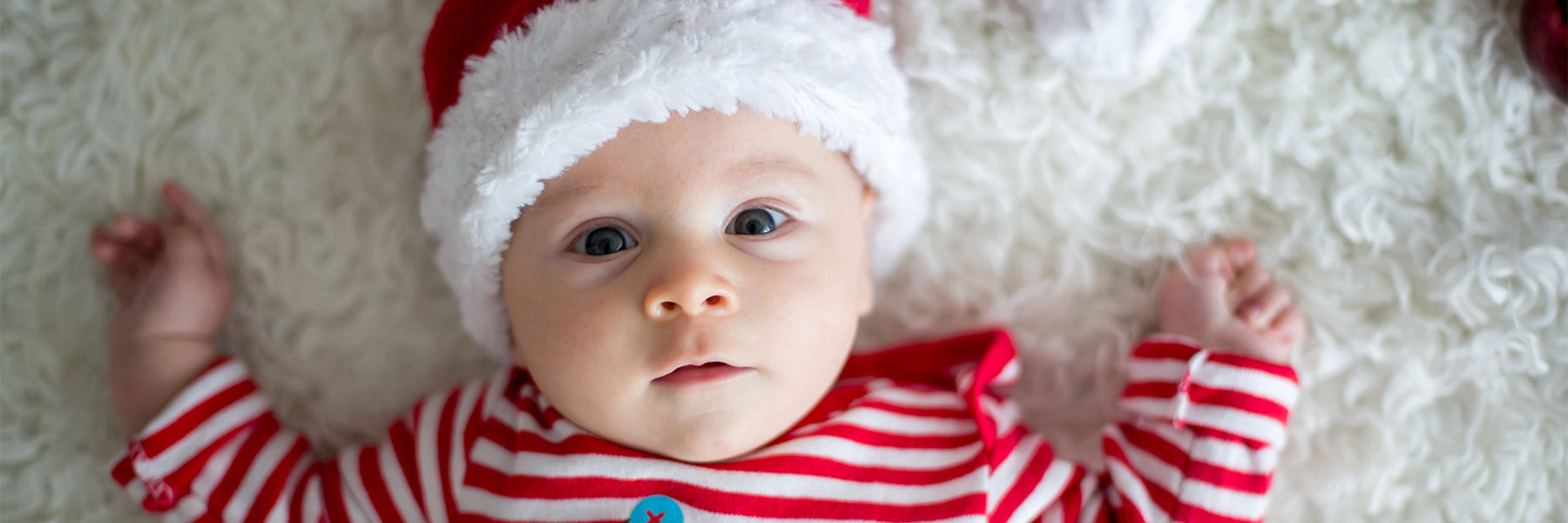 Baby wearing a Santa hat