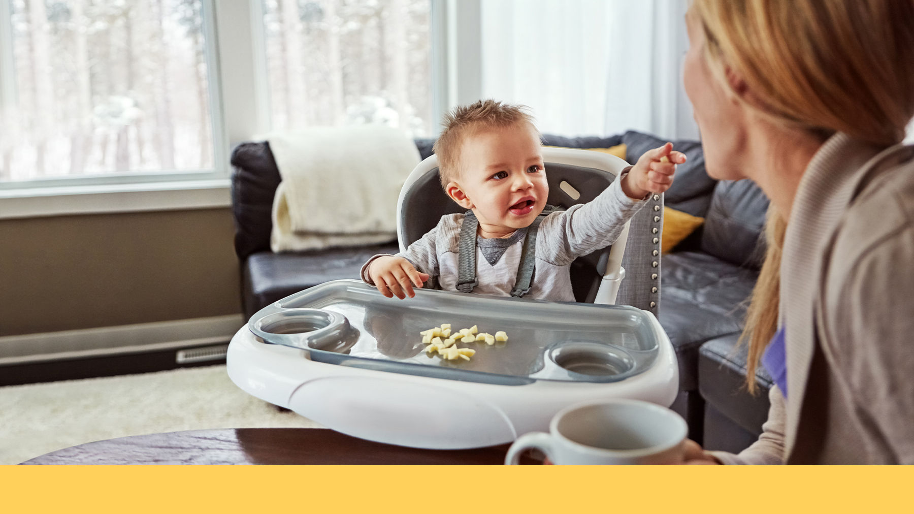 Baby eating in a highchair