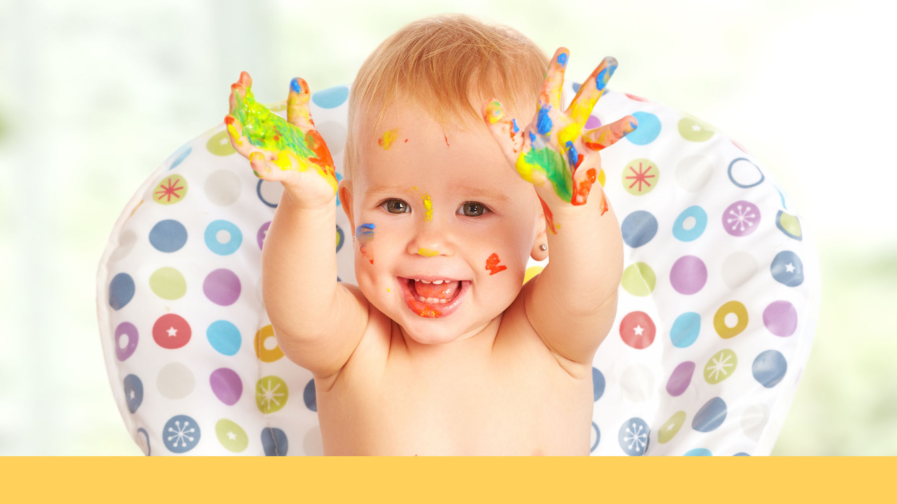 Baby playing with paint