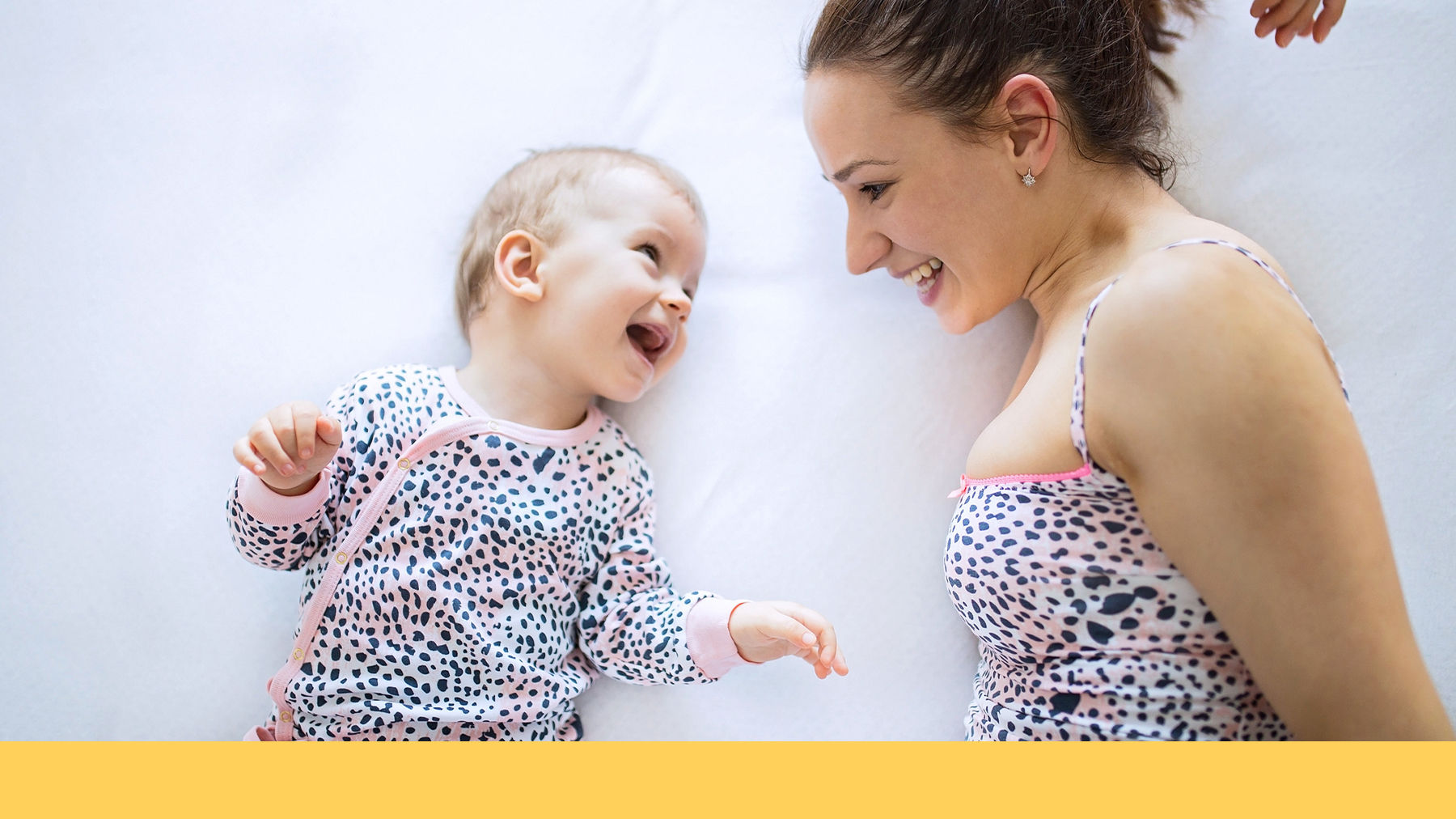 Mother and baby talking and laughing