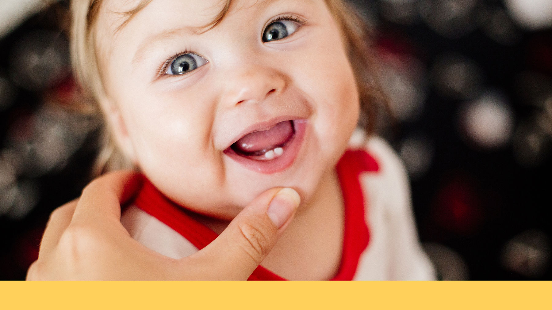 Baby smiling showing new teeth