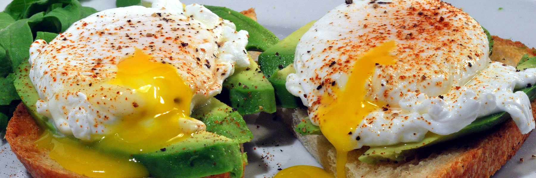 Poached eggs on toast with avocado