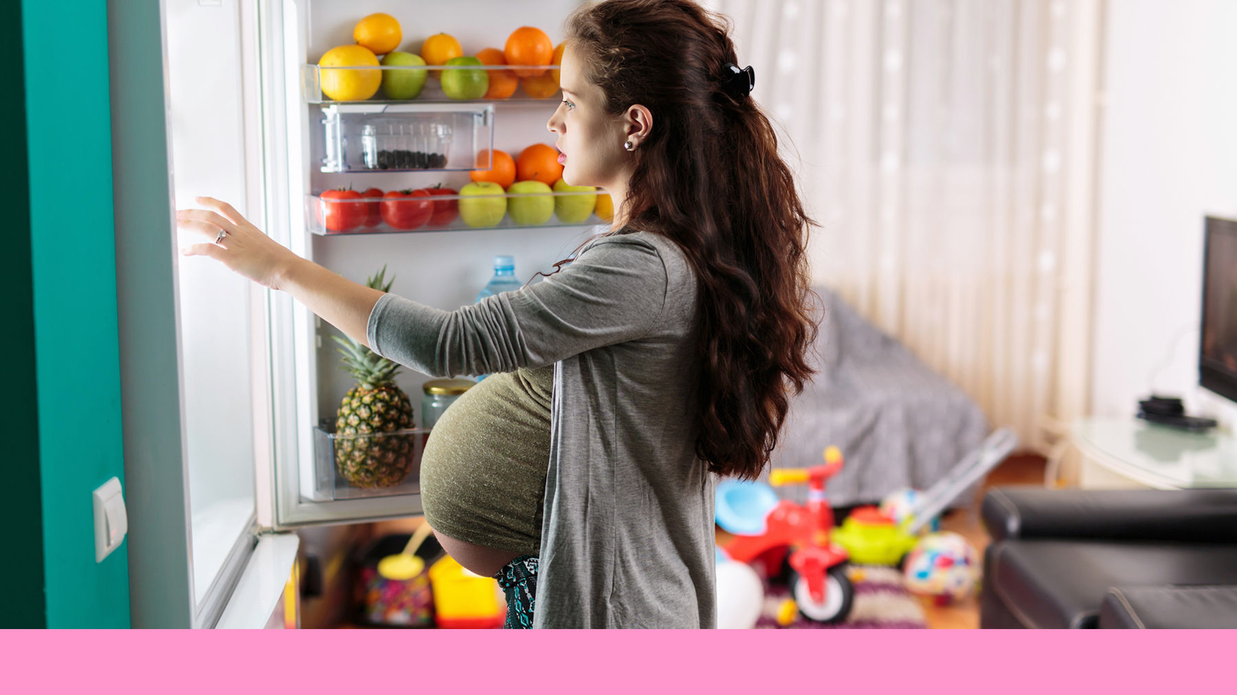 Pregnant woman looking in the fridge