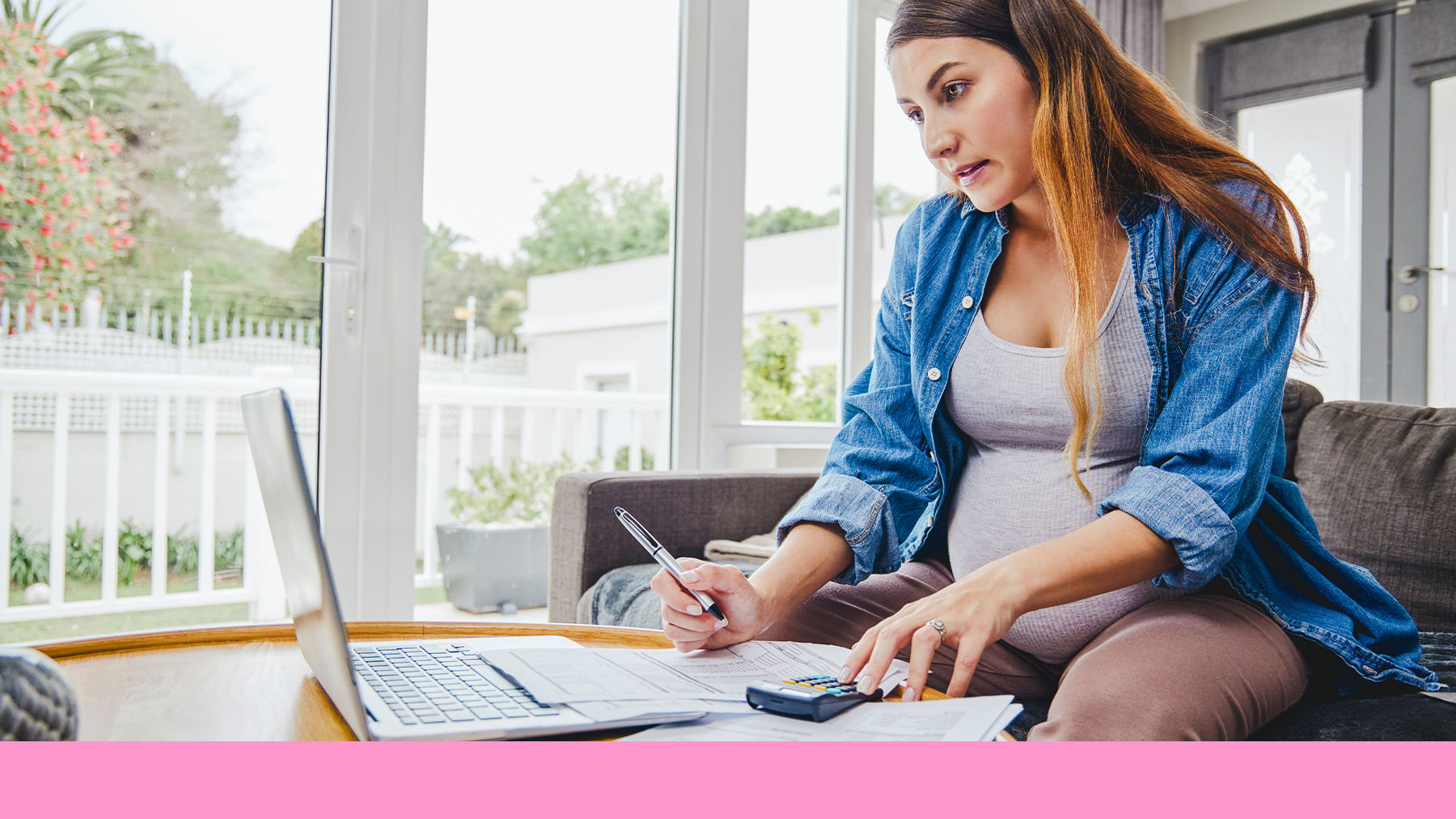 Pregnant woman working on a computer