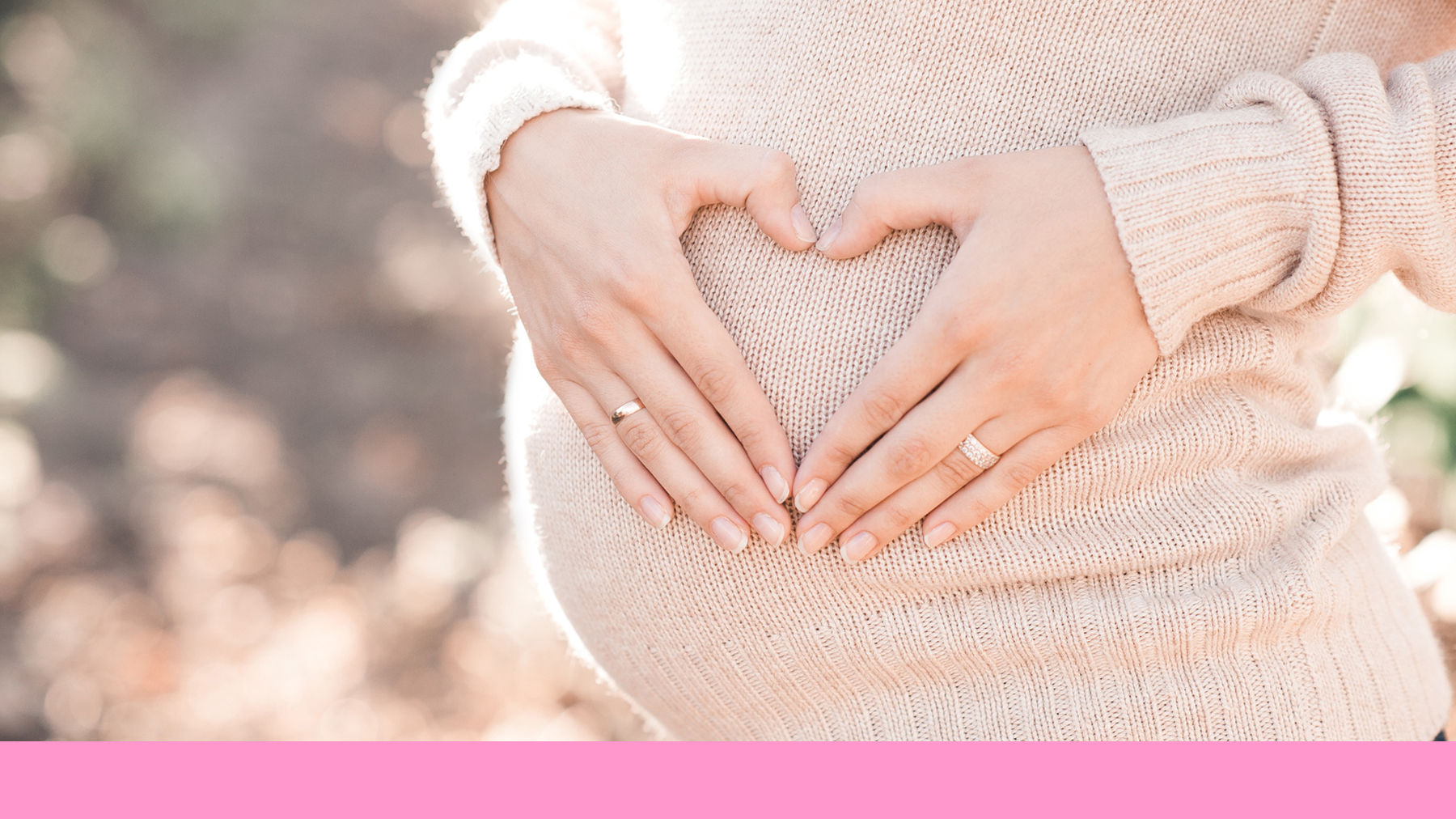 Pregnant woman holding her bump