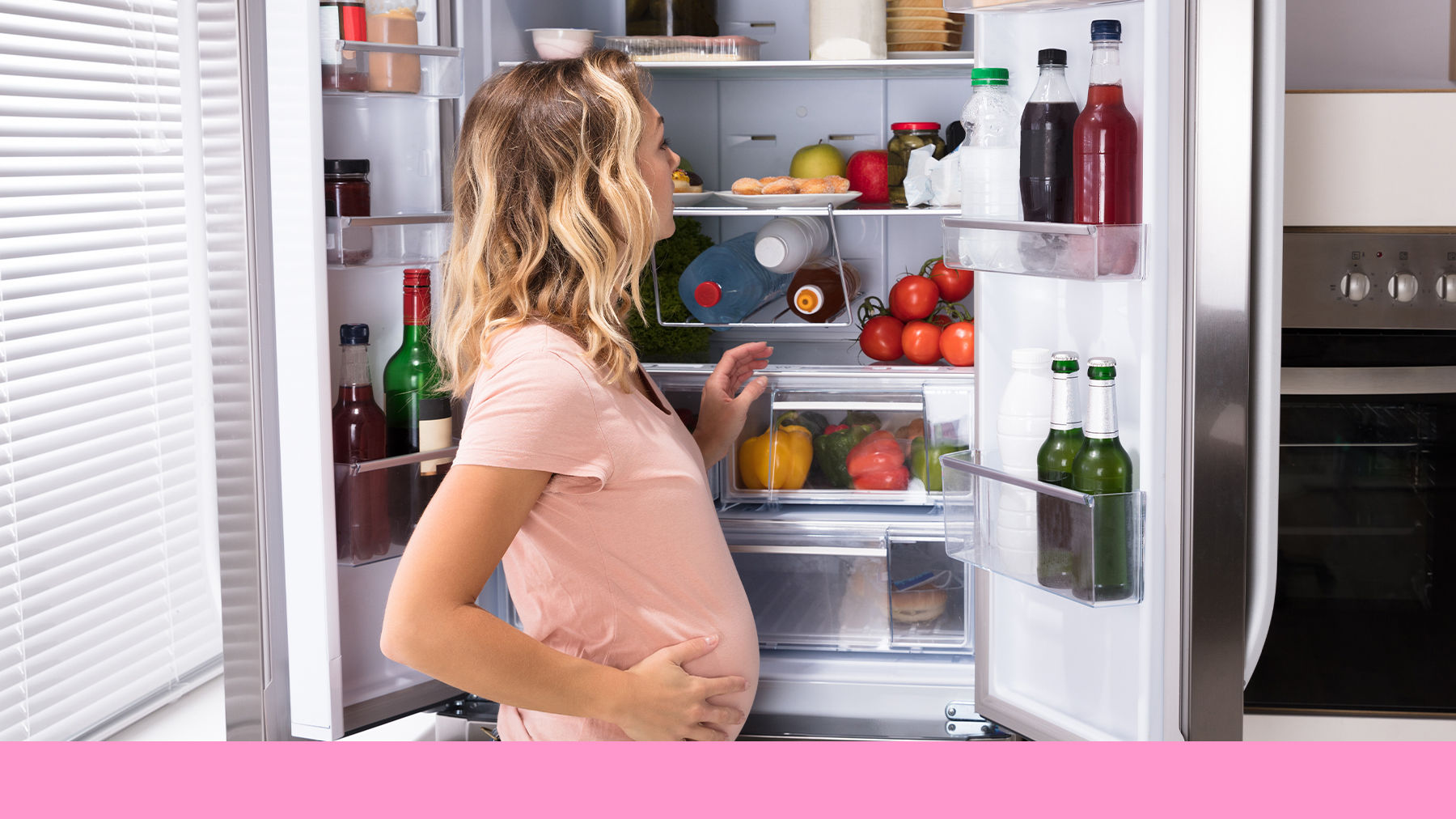 Pregnant woman looking in the fridge