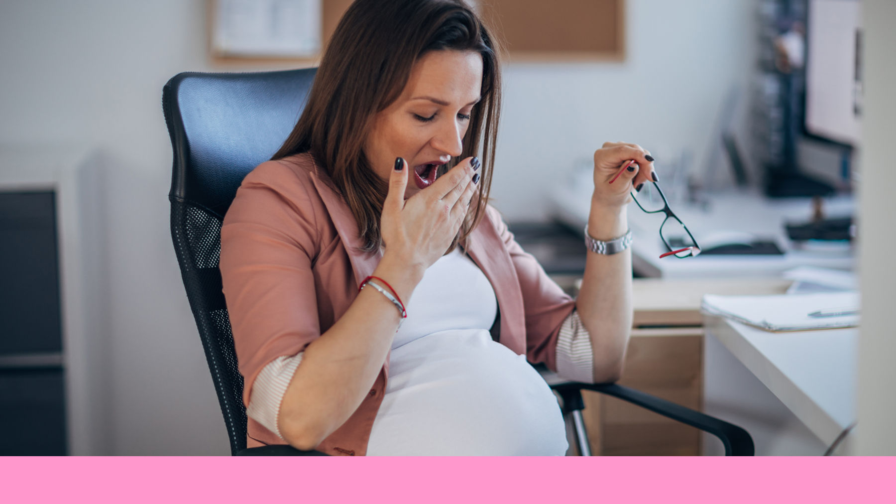 Pregnant woman yawning