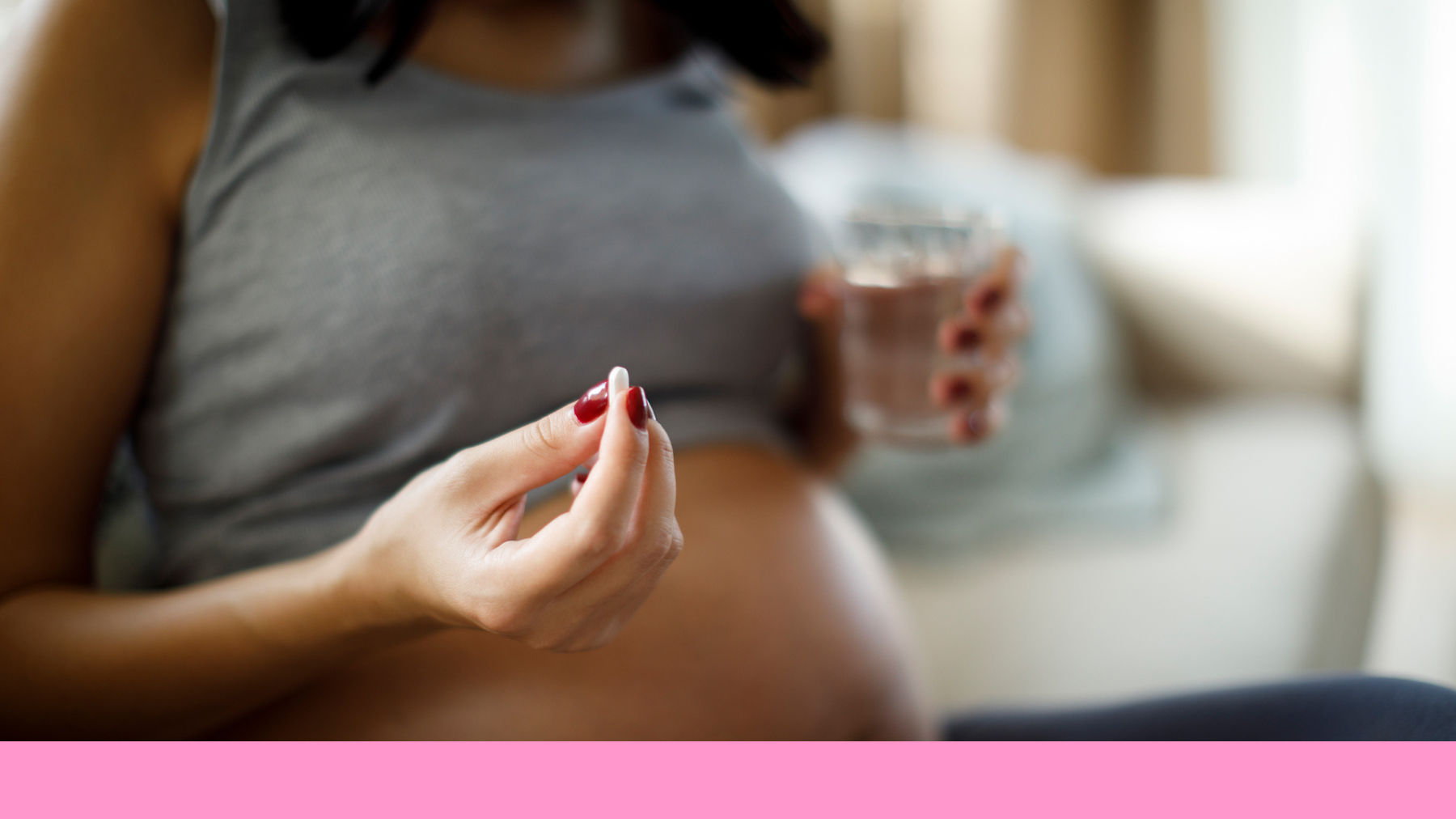 Pregnant woman taking vitamins