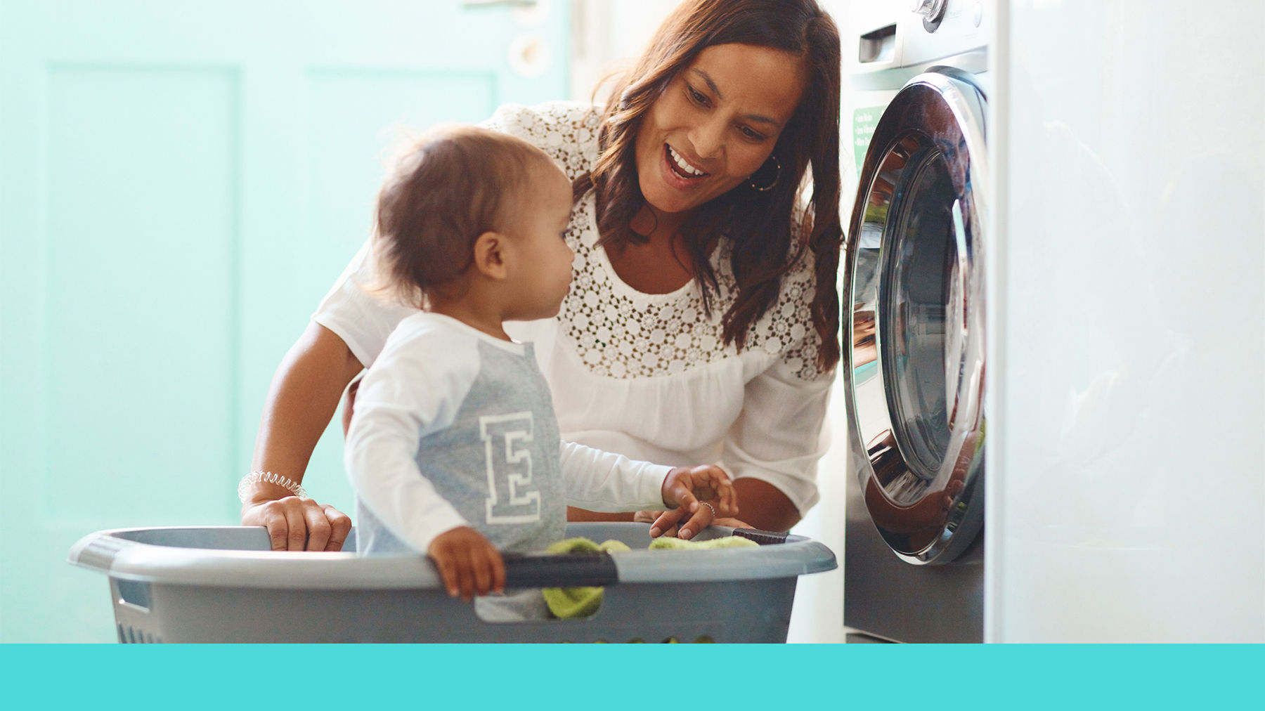Mother and toddler doing the laundry
