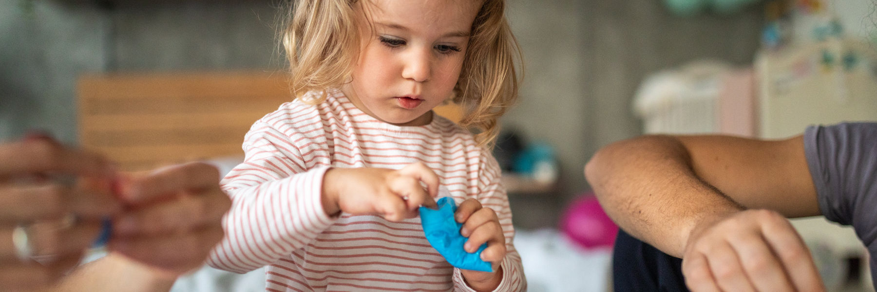 Toddler playing with toys
