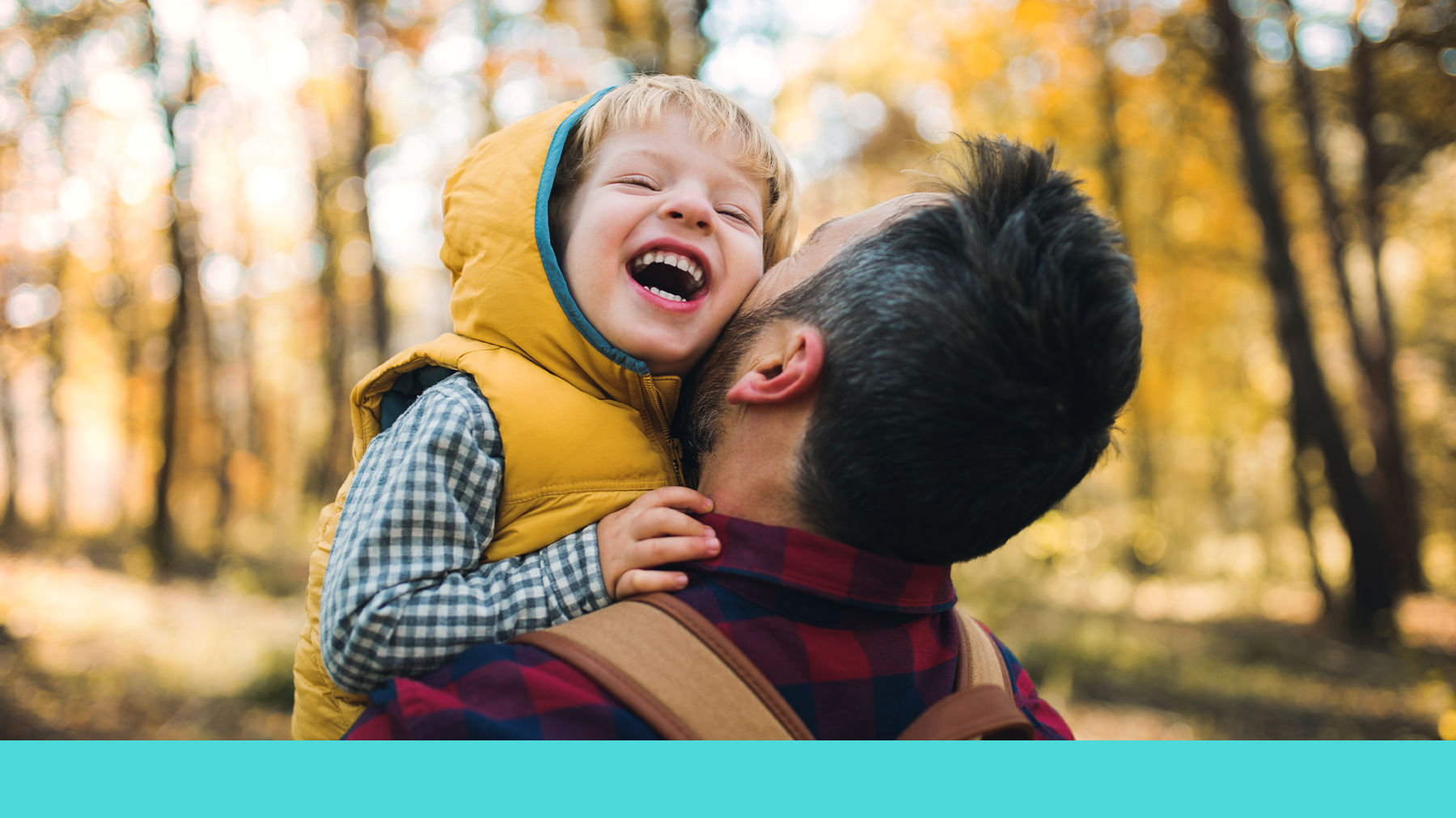 Toddler laughing and being carried