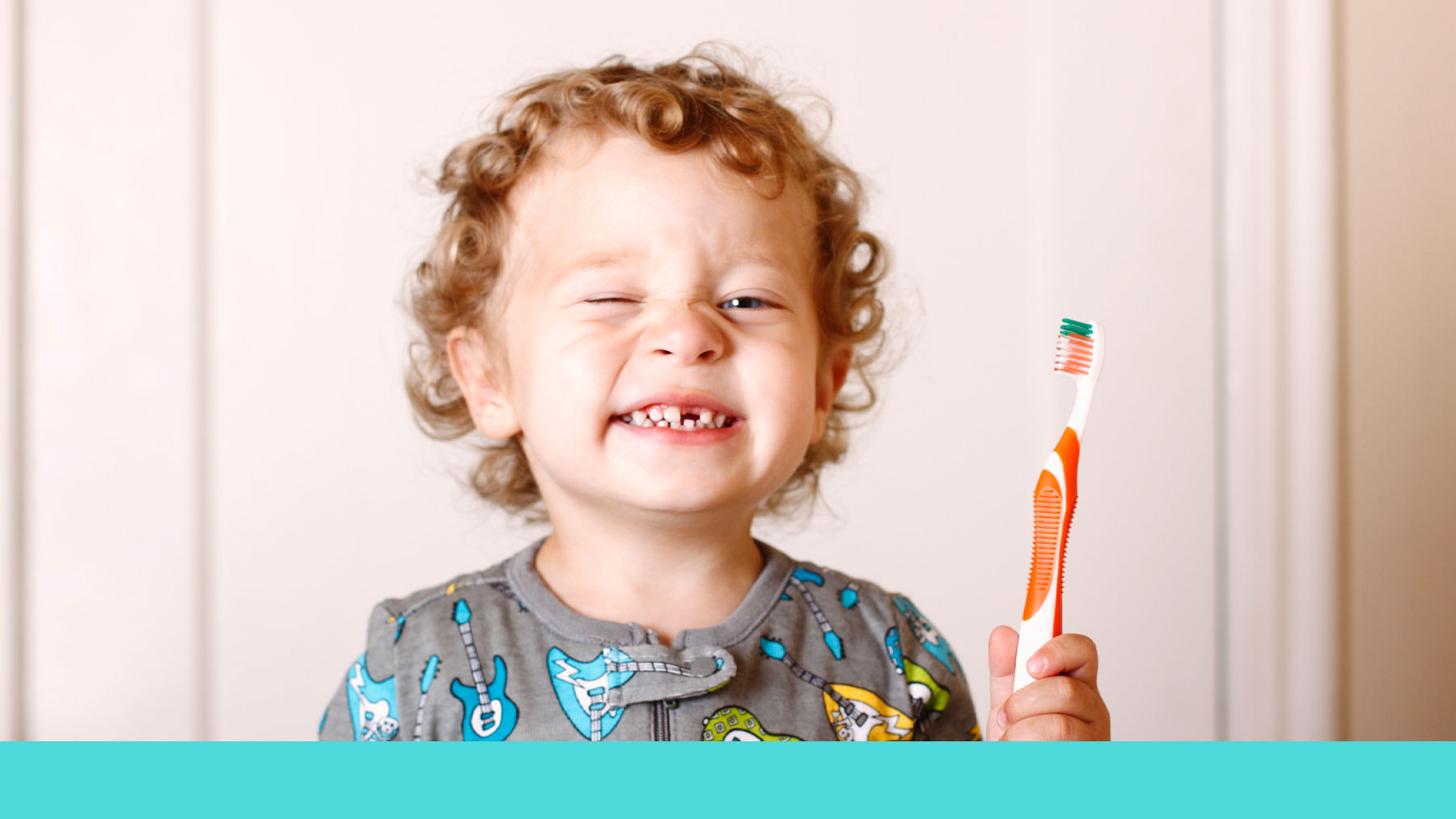 Toddler brushing their teeth