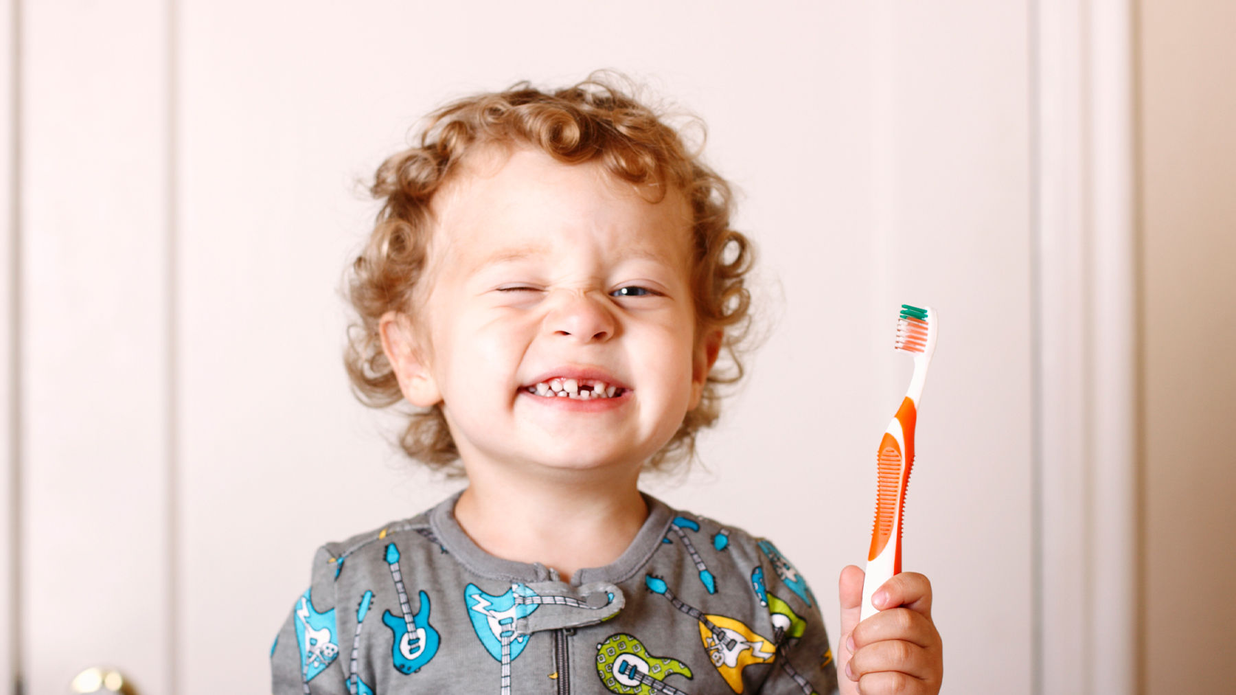 Toddler brushing their teeth