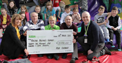 Former Asda Coleraine community champion Sheila Palmer with an Asda Foundation cheque for Building Ballysally Together