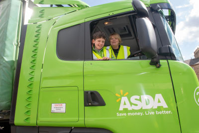Young customer Aaron Maxwell with an Asda lorry and community champion Margaret Bradie at our Falkirk store