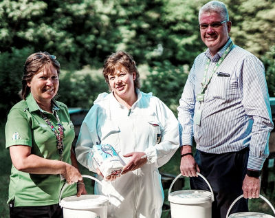 Clare Jones and Kenny Farrell from Asda Newport donate sugar to the Isle of Wight Beekeepers Association