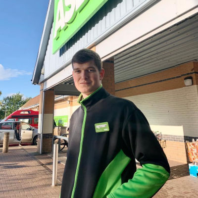 Brad Scollard from Asda Rossington helps elderly customer with her shopping