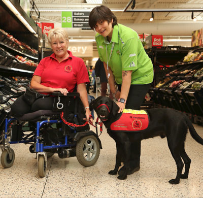 Assistance dog Paddy joins his owner Jill at Asda Golborne