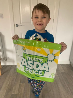 Logan Hutchison with his Asda Scan & Go carrier bag