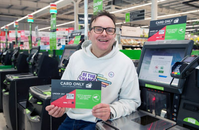 Asda Grangemouth customer David Allen with the redesigned card-only checkout sign