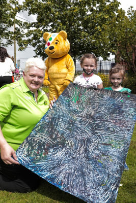 Elaine Livingstone from Asda Portadown joined Pudsey bear to visit the Sticky Fingers youth programme in Newry