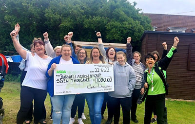 Asda Foundation grant for £7,000 to Burnhull Action Group presented by Liz Arbuckle from Asda Toryglen