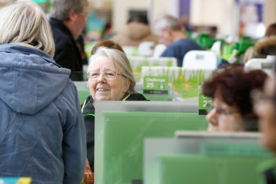 Carol at Asda Watford with a customer