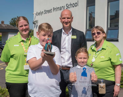 Asda colleagues with World Book Day competition winners