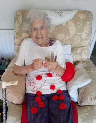 Asda Worcester customer Beatrice Furlong knits poppies for the Royal British Legion