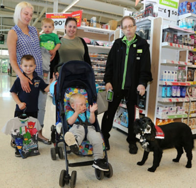 Asda Biggleswade colleague Russell and dog Ben with customers